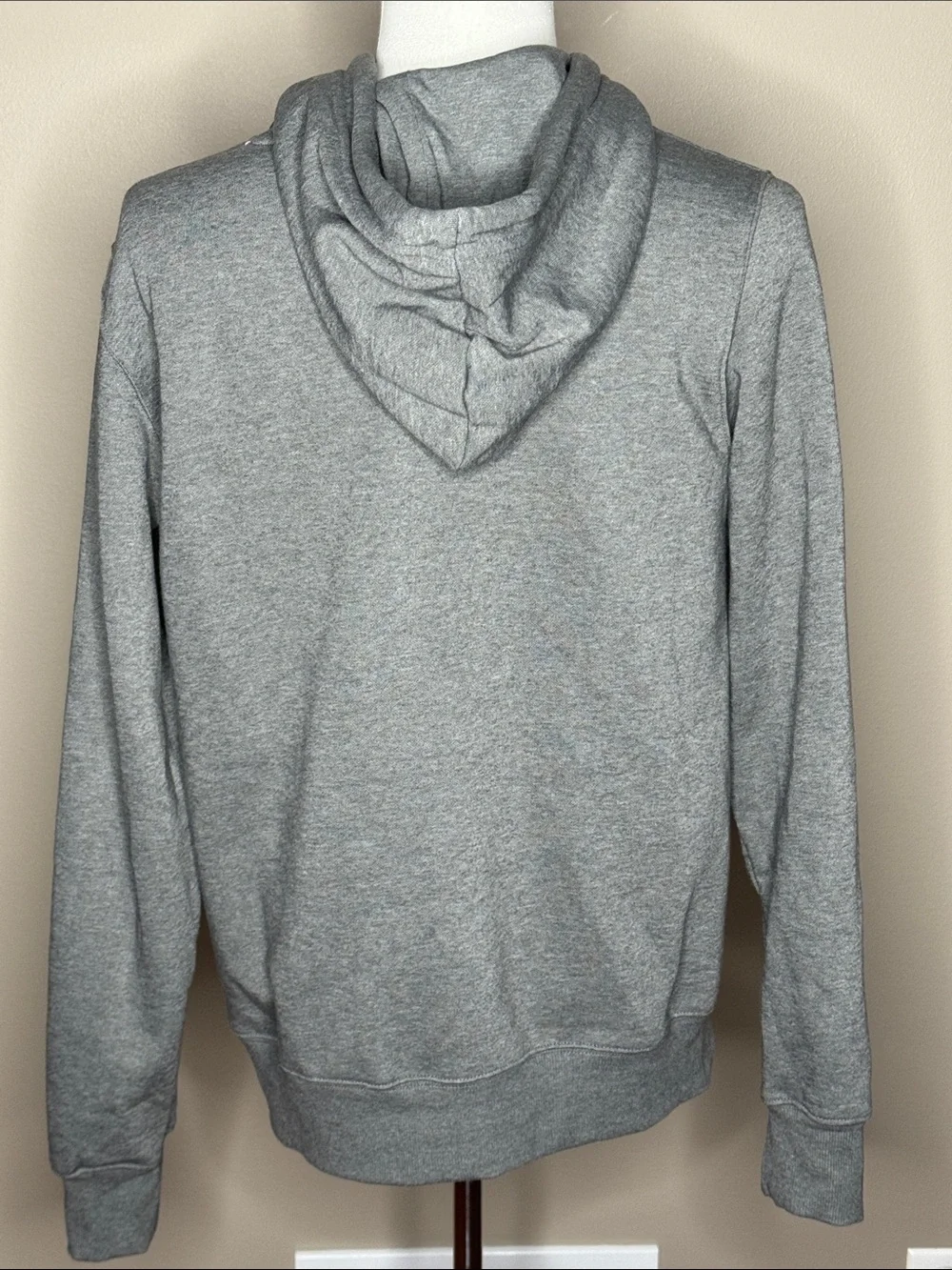 The North Face mens gray hooded sweatshirt size M with pockets.
